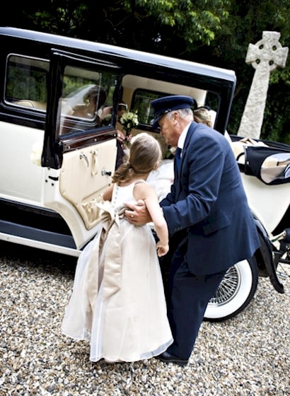 Driver helping the Bridesmaids into our Bramwith Limousine