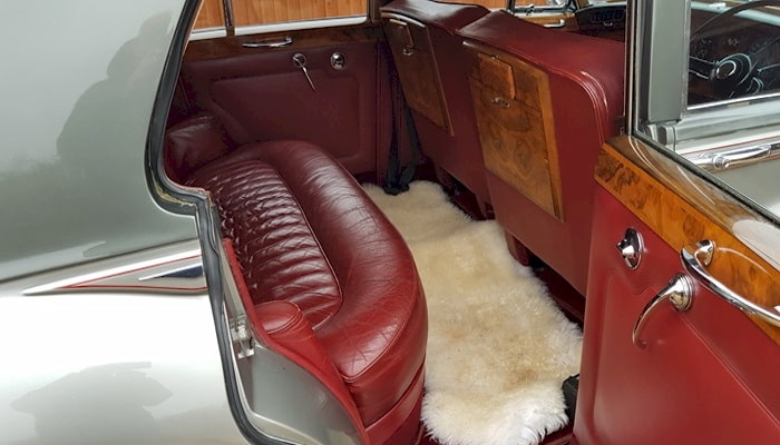 Bentley wedding car interior with sheepskin over carpet