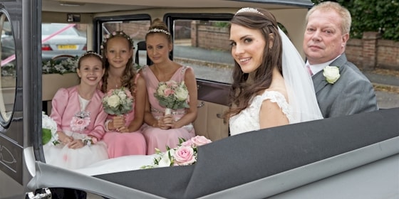 Imperial Wedding Limousine With Bridal Party In The Car
