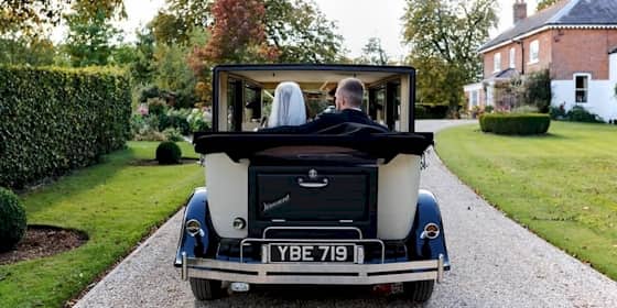 Bride And Groom Arriving At Their Reception In Viscount Wedding Car