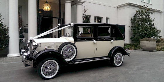 Bride And Groom At The Wedding Venue In Viscount Wedding Car